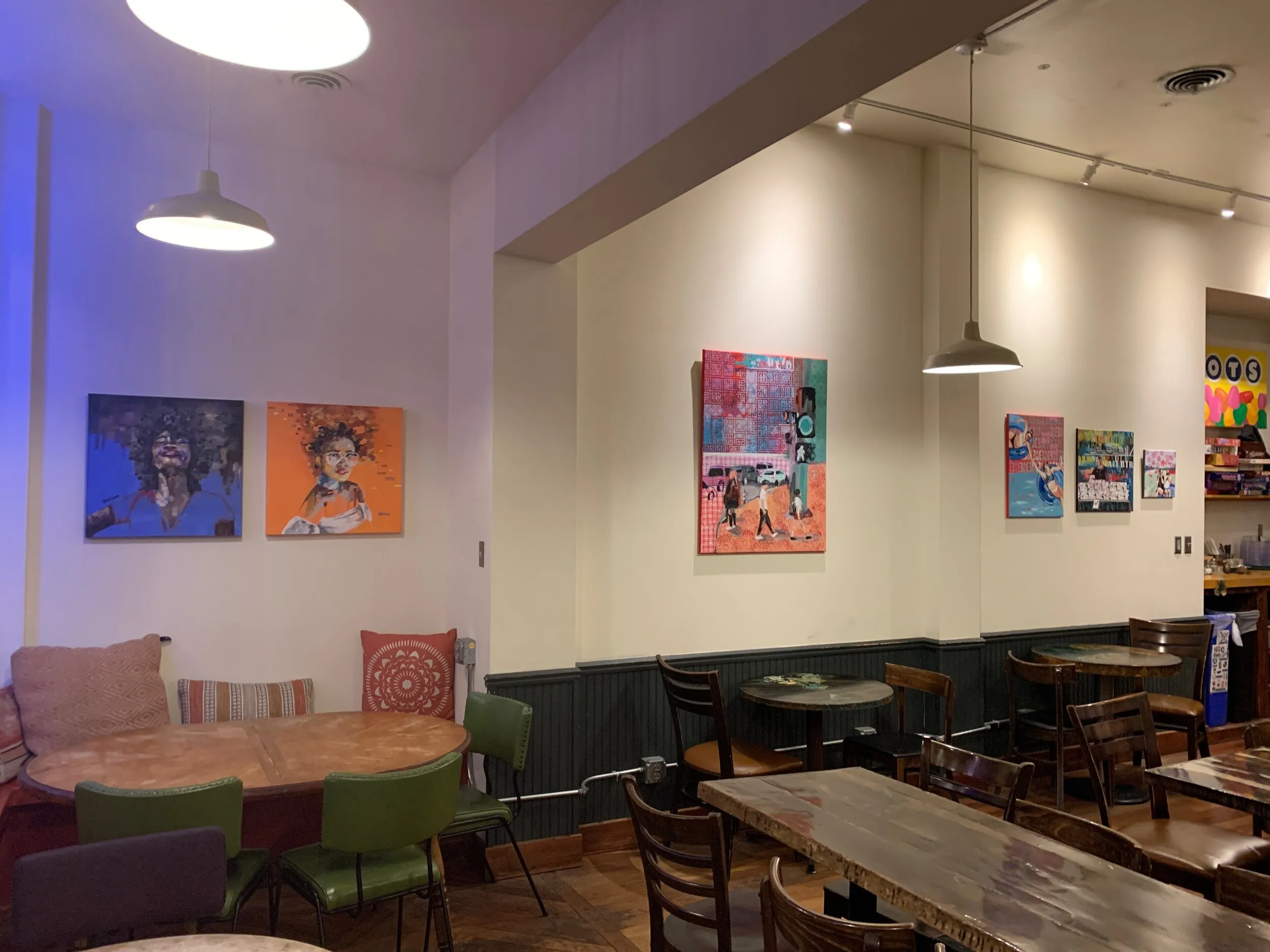 Thirteen paintings on the walls at Meshuggah Cafe in St. Louis for the month of March.
